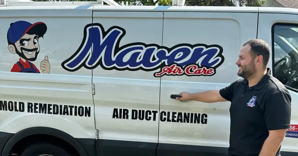 Technician from Maven Air Care performing professional air duct cleaning in a home